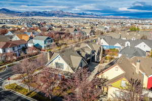 Aerial perspective of suburban area featuring a mountainous background