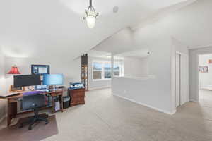 Office with light carpet and baseboards