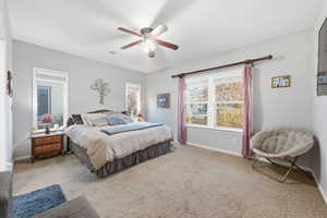 Bedroom featuring carpet and a ceiling fan