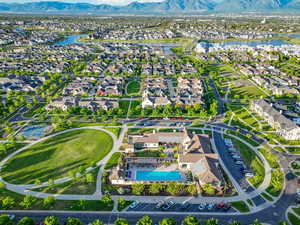 Aerial perspective of suburban area featuring a water and mountain view