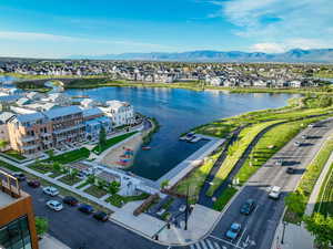Aerial view of residential area featuring a water and mountain view