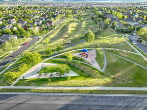 Aerial view of property's location featuring nearby suburban area