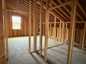 Miscellaneous room featuring vaulted ceiling