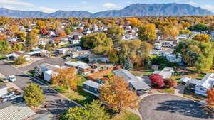 Aerial perspective of suburban area with a mountainous background