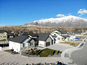 Aerial perspective of suburban area featuring a mountain backdrop