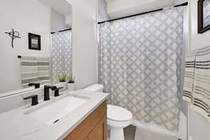 Full bathroom with vanity, tile patterned flooring, and shower / tub combo with curtain