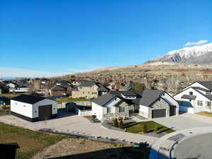 Aerial view of residential area featuring a mountain backdrop