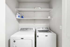 Washroom featuring independent washer and dryer