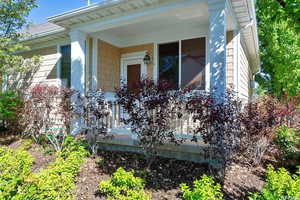 Property entrance with covered porch