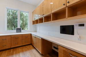 Unfurnished office featuring light wood-style flooring