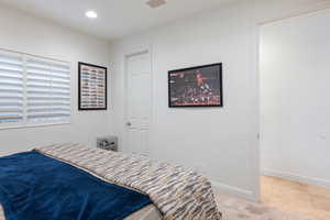 Bedroom with carpet flooring and recessed lighting