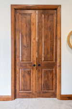 Detailed view of baseboards and carpet flooring