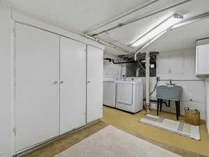 Laundry room featuring separate washer and dryer