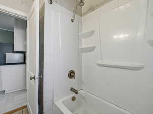Bathroom with shower / washtub combination