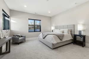 Carpeted bedroom featuring baseboards and recessed lighting