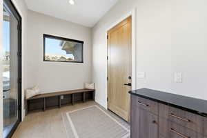 Mudroom featuring recessed lighting and baseboards