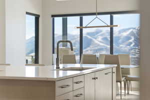 Kitchen featuring a sink and light stone countertops