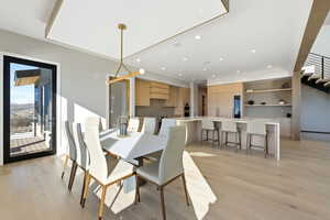 Dining space featuring light wood-style floors and recessed lighting