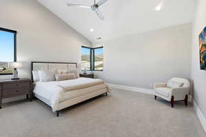 Carpeted bedroom featuring high vaulted ceiling, a ceiling fan, and recessed lighting