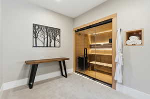 Relaxing sauna with carpet floors and baseboards