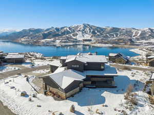 Snowy aerial view featuring a mountain view
