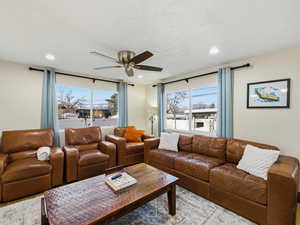Living room featuring ceiling fan, healthy amount of natural light, and recessed lighting
