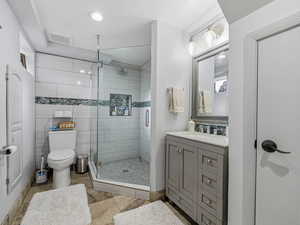Bathroom with vanity, a stall shower, recessed lighting, and light tile patterned flooring