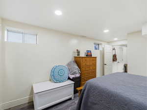 Bedroom with dark wood-type flooring and recessed lighting