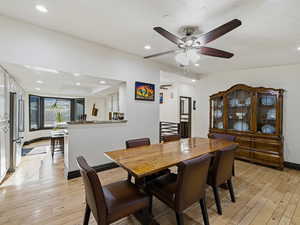 Dining space featuring light wood finished floors, recessed lighting, and ceiling fan
