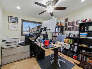 Home office featuring light wood-style flooring, recessed lighting, and ceiling fan