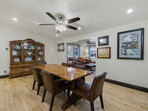 Dining area featuring light wood-type flooring, recessed lighting, and ceiling fan