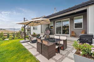 View of patio / terrace with area for grilling, outdoor lounge area, and a mountain view