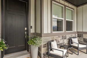 Property entrance featuring stone siding