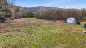 View of large clearing on property for a picnic area with mountain views