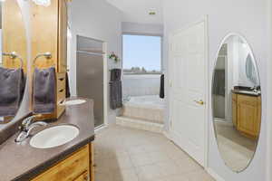 Ensuite master bathroom with double sinks, large shower, jetted tub, private water closet and huge master closet