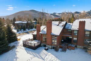 Snowy aerial view with a mountain view