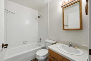 Bathroom featuring tub / shower combination and vanity