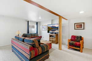 Carpeted living area featuring recessed lighting