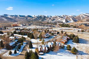 Snowy aerial view featuring a mountain view
