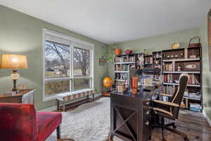 Office featuring baseboards and wood finished floors