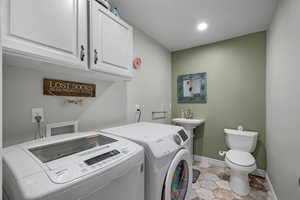 Washroom with washer and clothes dryer, recessed lighting, and light tile patterned floors