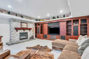 Carpeted living room with a fireplace