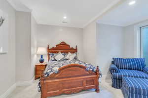 Bedroom with carpet, crown molding, and recessed lighting