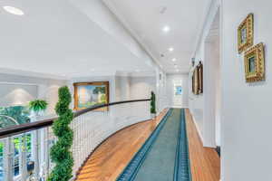 Corridor featuring crown molding, hardwood / wood-style floors, and recessed lighting