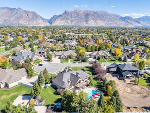 Aerial perspective of suburban area with a mountain backdrop