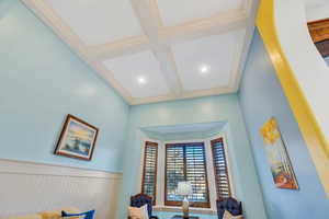 Detailed view of coffered ceiling, beam ceiling, and ornamental molding