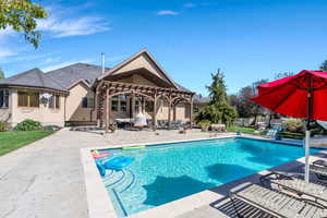 View of pool featuring a pergola and a patio