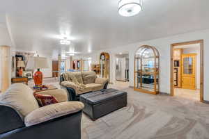 Living room featuring light colored carpet