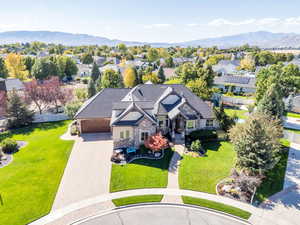 Aerial perspective of suburban area featuring a mountain backdrop
