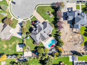 Aerial view of residential area featuring a pool